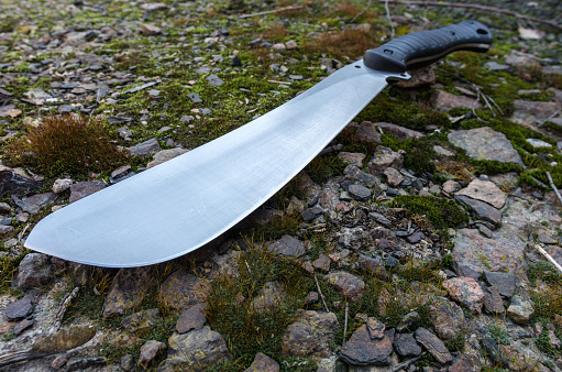 Large working knife. Photo of a machete at an angle. Work tool.
