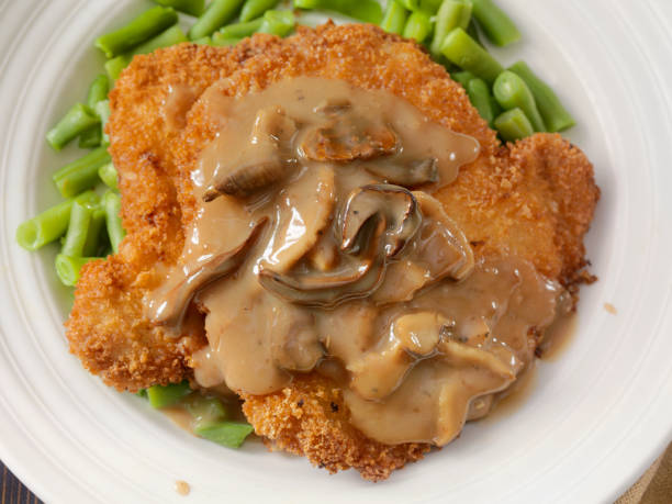 Breaded Schnitzel with Mushroom Sauce and Green Beans