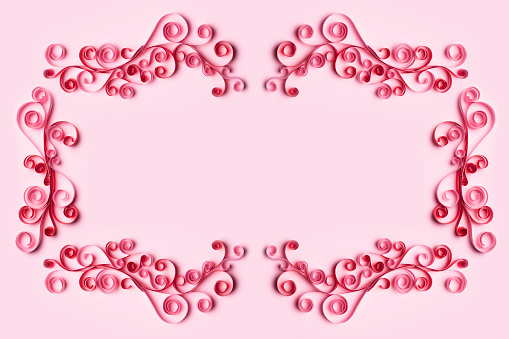 Paper Art Quilling  flower Filigree frame on pink background
