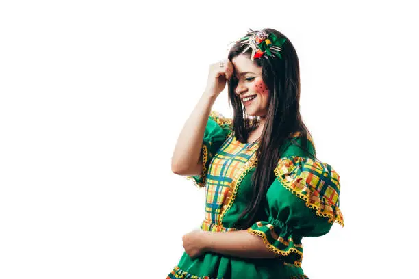 Photo of Brazilian woman dancing and wearing typical clothes for the Festa Junina