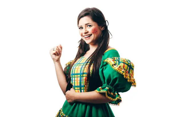 Photo of Brazilian woman dancing and wearing typical clothes for the Festa Junina