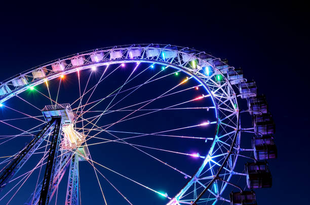 istock Big ferris wheel with festive colorful illumination 959366850