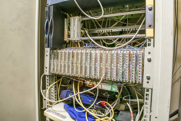 istock A switch box with equipment for telephony and the Internet. Distribution cabinet with patch panels 959367766