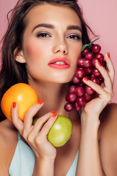istock Woman holding fruits 959371632