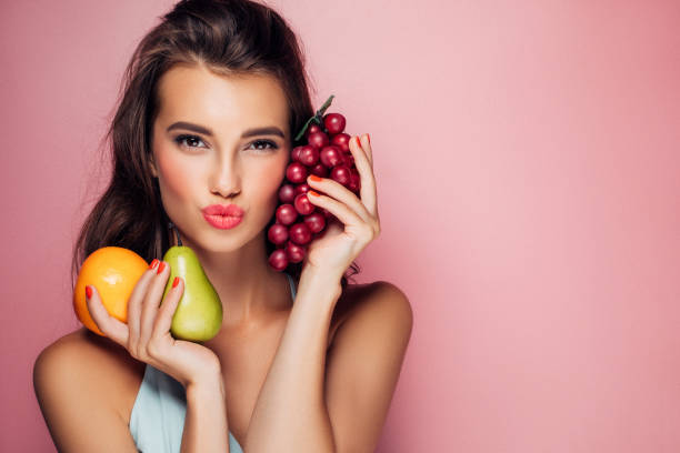 istock Woman holding fruits 959371642