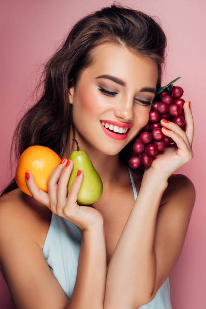 istock Woman holding fruits 959371658