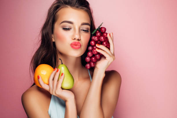 istock Woman holding fruits 959371674