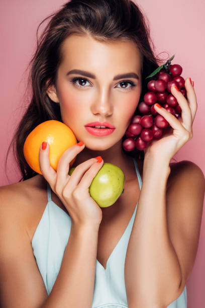 istock Woman holding fruits 959371684