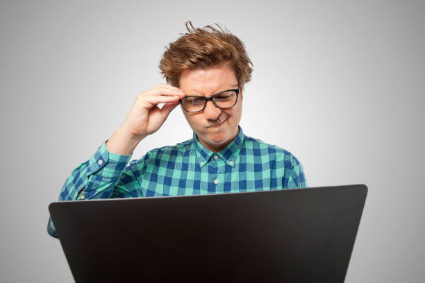 istock Nerd with Laptop looking confused about something 959381460