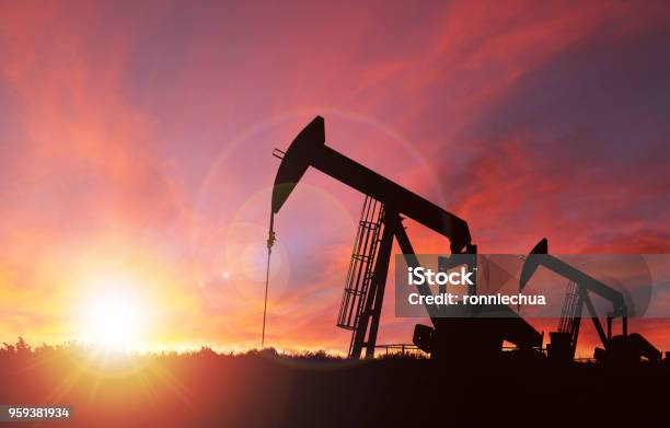 Sunset Over Pumpjack Silhouette With Copy Space Stock Photo - Download Image Now - Crude Oil, Gasoline, Natural Gas