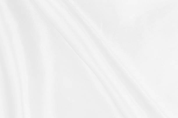 istock White fabric texture for background and design, beautiful pattern of silk or linen. 959386132