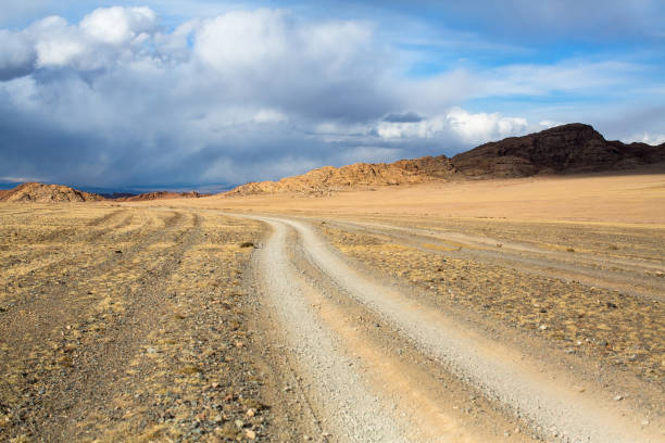 istock Road through the steppe and mountains of Western Mongolia. 959386392