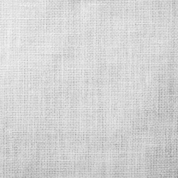 istock Hessian sackcloth woven fabric texture background light white grey color 959387270