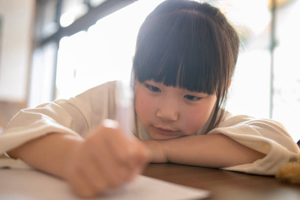 istock Little girl drawing on paper 959390580