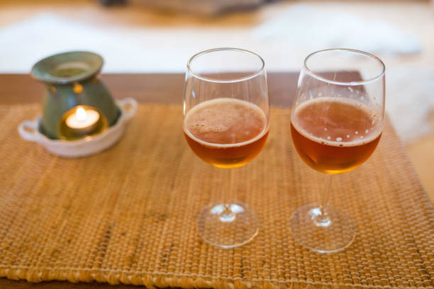 istock Beer glasses with aroma lamp romantic time at fireplace 959391742