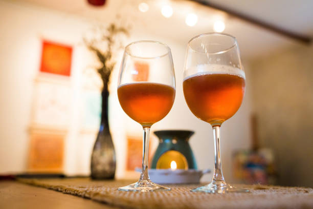 istock Beer glasses with aroma lamp romantic time at fireplace 959391750