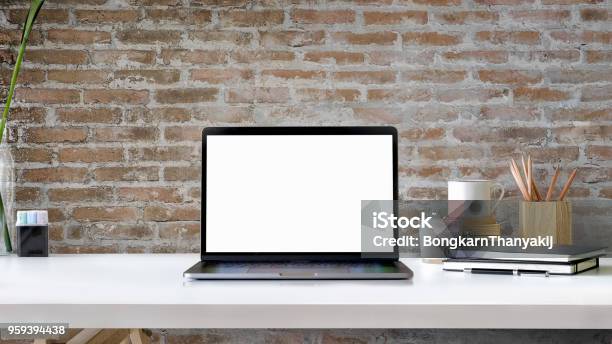 Contemporary Workspace With Blank Screen Laptop On White Wood Table Stock Photo - Download Image Now