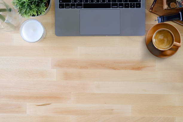 istock Office wooden desk computer and coffee mug with copy space. 959394462