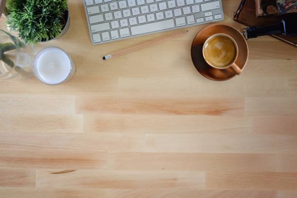 istock Office wooden desk computer and coffee mug with copy space. 959394464