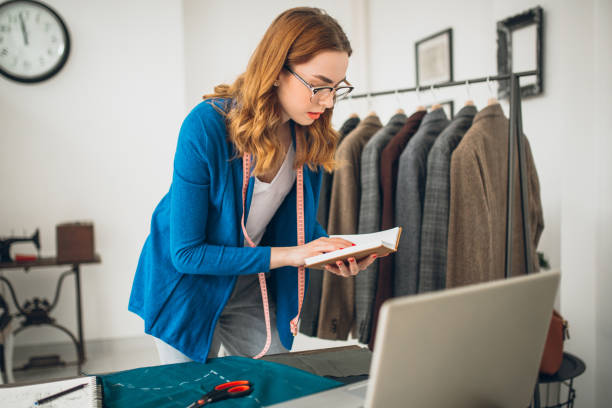 istock Clothes designer working in tailor shop 959394628
