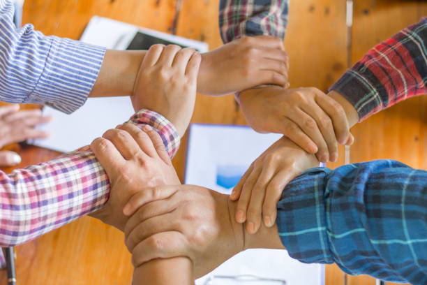 istock Hands of success startup business teamwork. Creative idea teamwork concept. Group of multiethnic diverse team 959395434