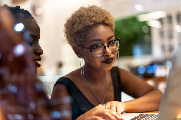 istock Two Business woman meeting through window 959398170