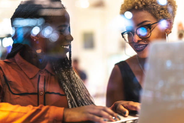 istock Two Business woman meeting through window 959398298