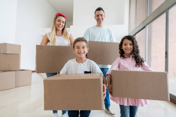 istock Happy family moving house 959398638