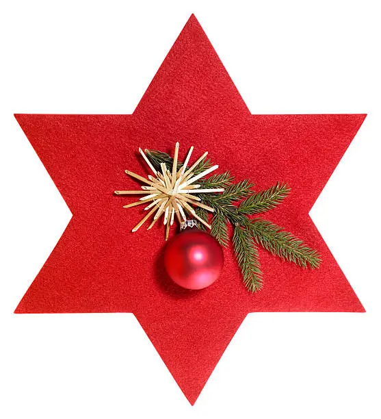 christmas decoration in front of a red felt star, isolated on white with clipping path