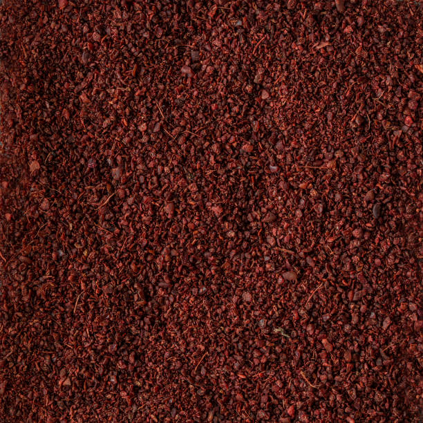 istock spice sumac  as background texture. Organic food 959411516