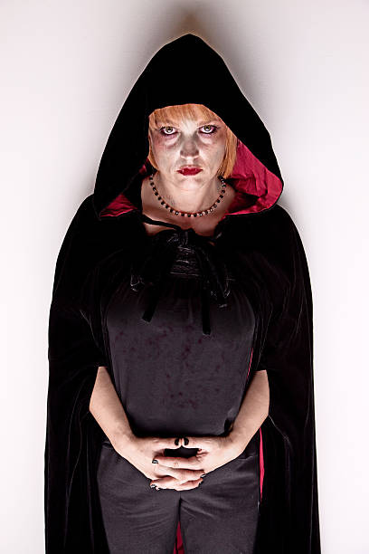 istock Female Vampire in a Dark Hood 95942192