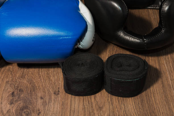 istock Boxer's professional outfit on a wooden background 959422974