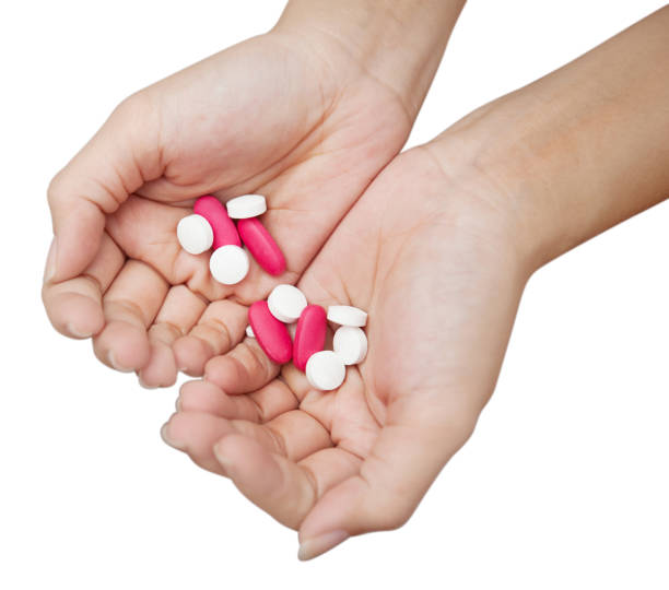 istock hands holding bunch of pills is on white background with clipping path , overdose concept 959427848