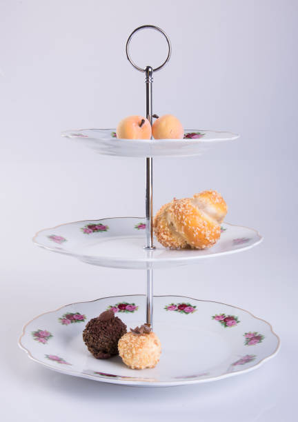 istock tray or three tier serving tray with dessert on background 959429864