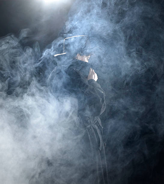 dark dressed woman in smoky ambiance