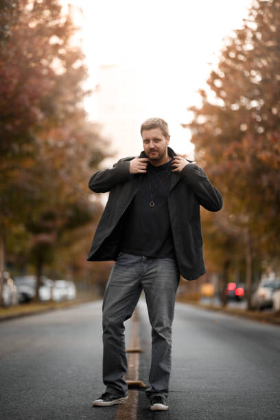 A man walking in the middle of a street