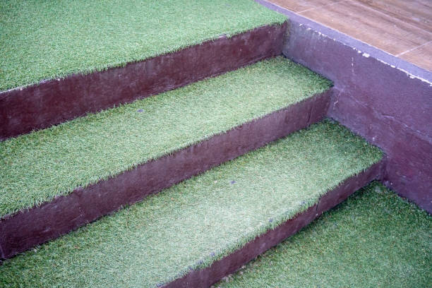 istock Artificial green grass on concrete stairs for nature theme  decoration concept. 959434716