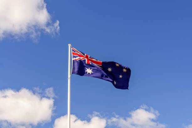 istock Australian flag blowing in the wind 959435542