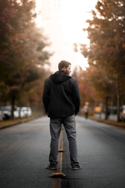 istock Man on his back at street 959437638