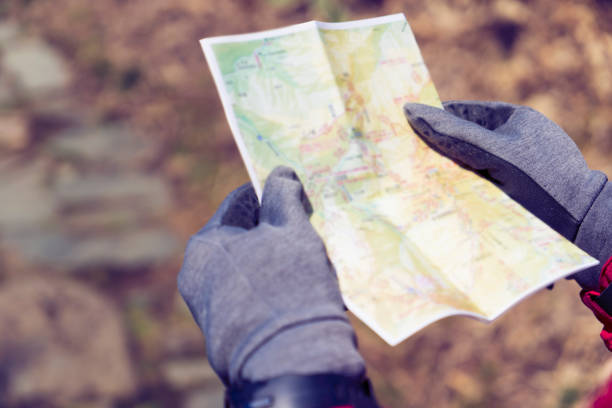 istock Woman hiking with a map 959438474