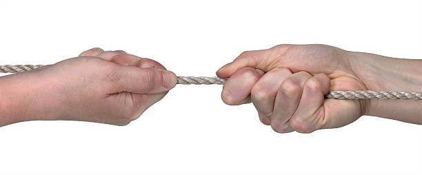 istock tug of war with two hands 95943898