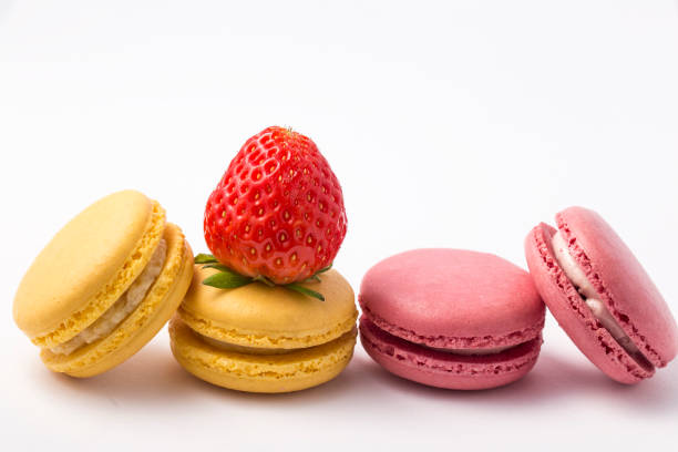 istock Sweet colorful macarons isolated on white background. 959442600