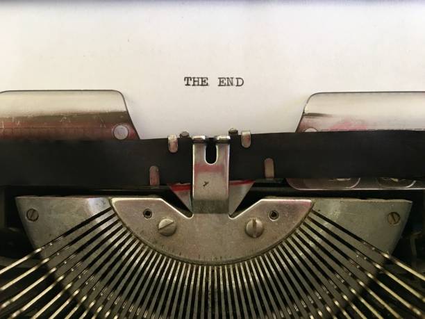 The End typed on white paper on vintage typewriter The End typed on white paper on vintage 1960s manual typewriter typewriter keyboard stock pictures, royalty-free photos & images