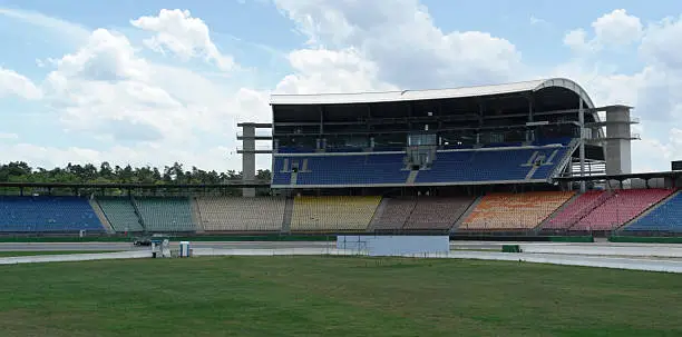part of a racetrack named "Hockenheimring" in Southern Germany with tribune and multi colored seat rows