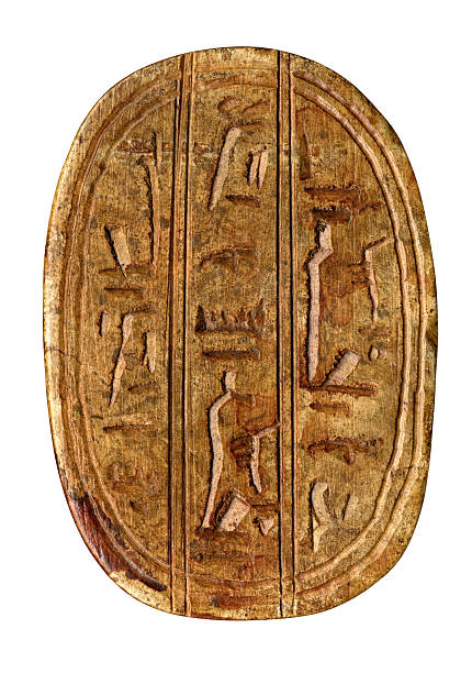 brown stained plate with carved egyptian symbols isolated on white with clipping path