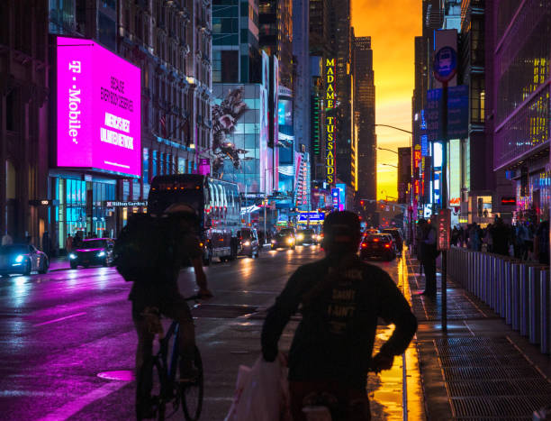 New York 42nd Street in Colorful Lights with Orange Sunset Background stock photo