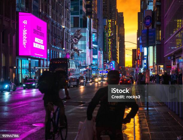 New York 42nd Street In Colorful Lights With Orange Sunset Background Stock Photo - Download Image Now