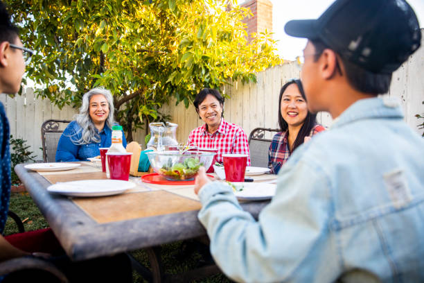 istock Teenage Boy Telling Story at Dinner Table 959451668