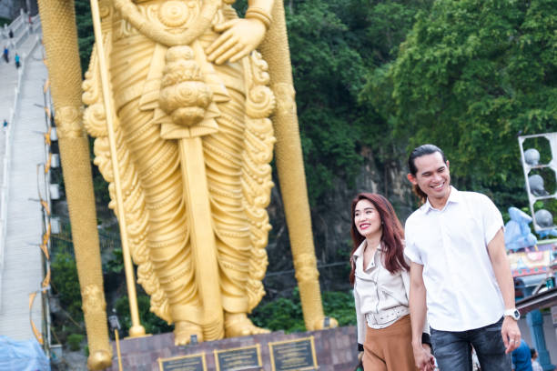 istock Couple visiting the Batu Caves 959451942