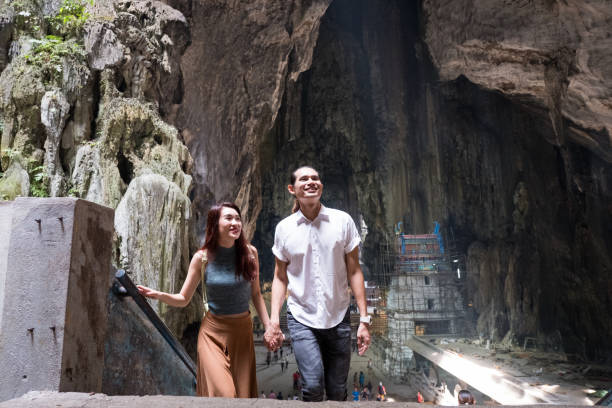 istock Couple visiting the temple at the Batu Caves 959452984